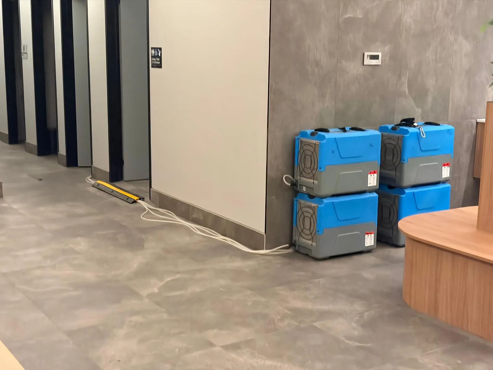 Dehumidifier units: Dehumidifiers ready for controlled drying.