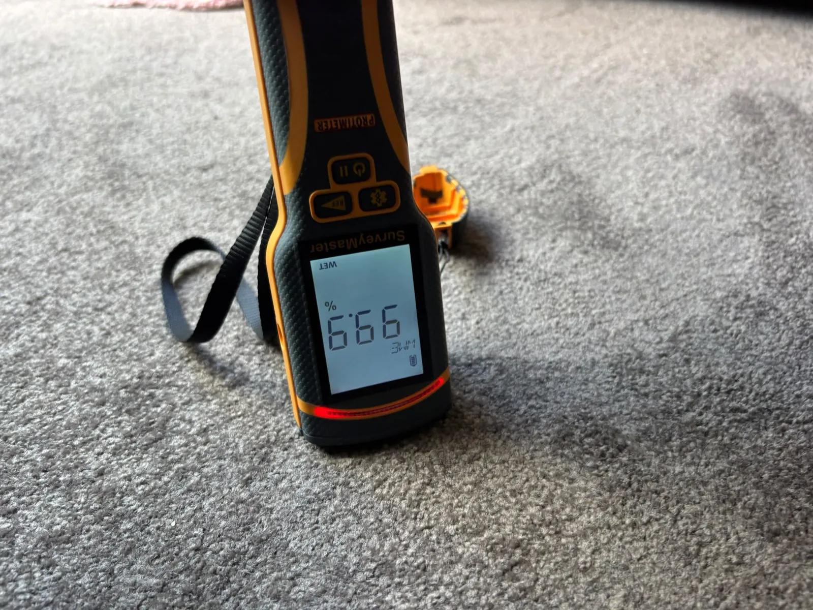 Carpet reading close-up: Instrument used to check moisture in floor finishes.