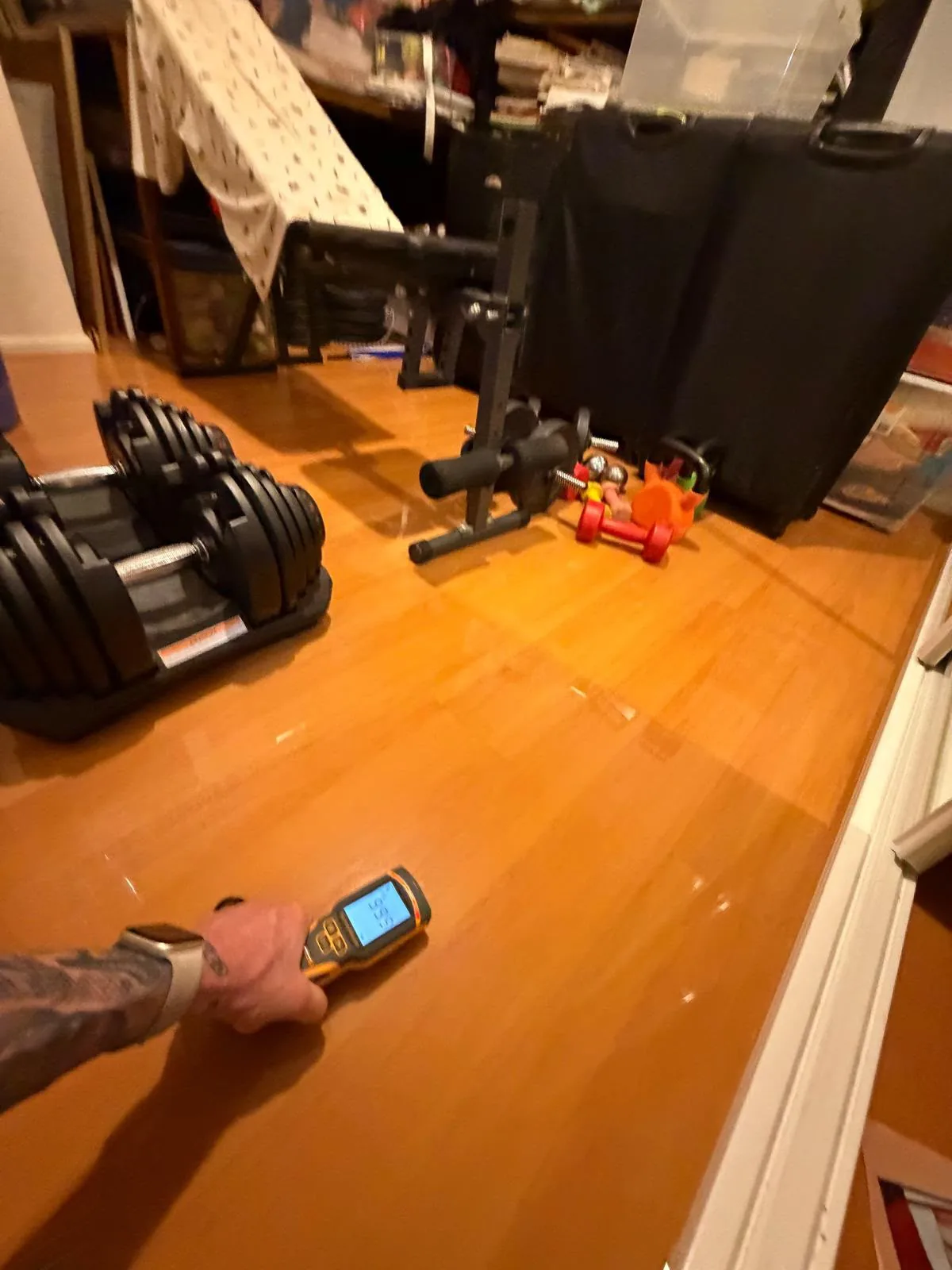Floor condition monitoring: Handheld readings taken near affected finishes.